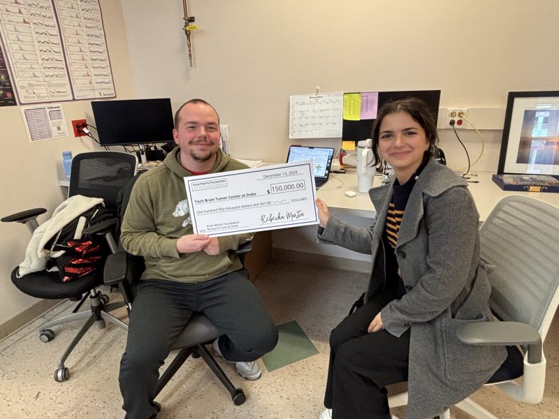 Chelsea and Grayson proudly displaying grant from the Knox Martin Foundation